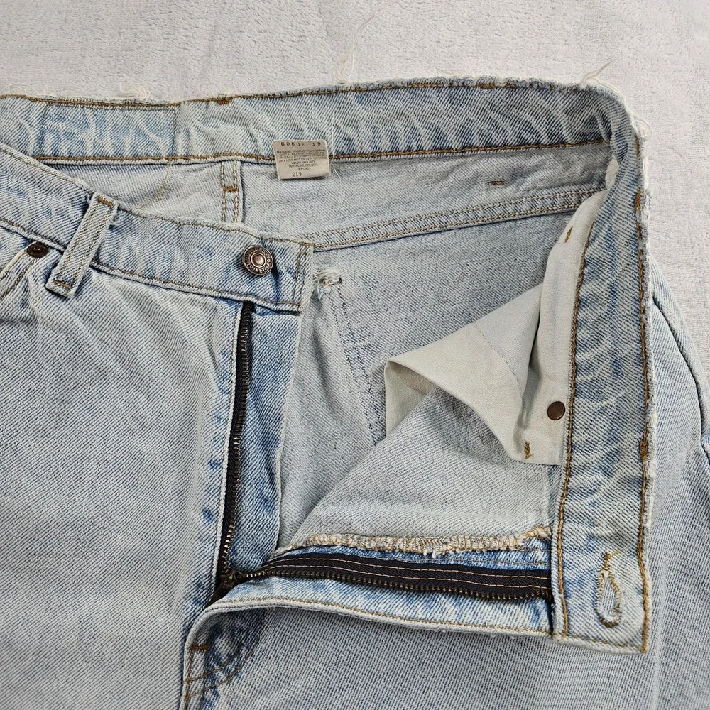 Vtg Levi's 560 Orange Tab Jeans 34x29 90s USA Loose Tapered Light Wash Raw Hem